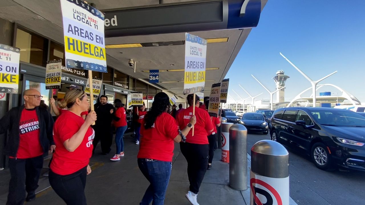 LAX workers walk out on strike